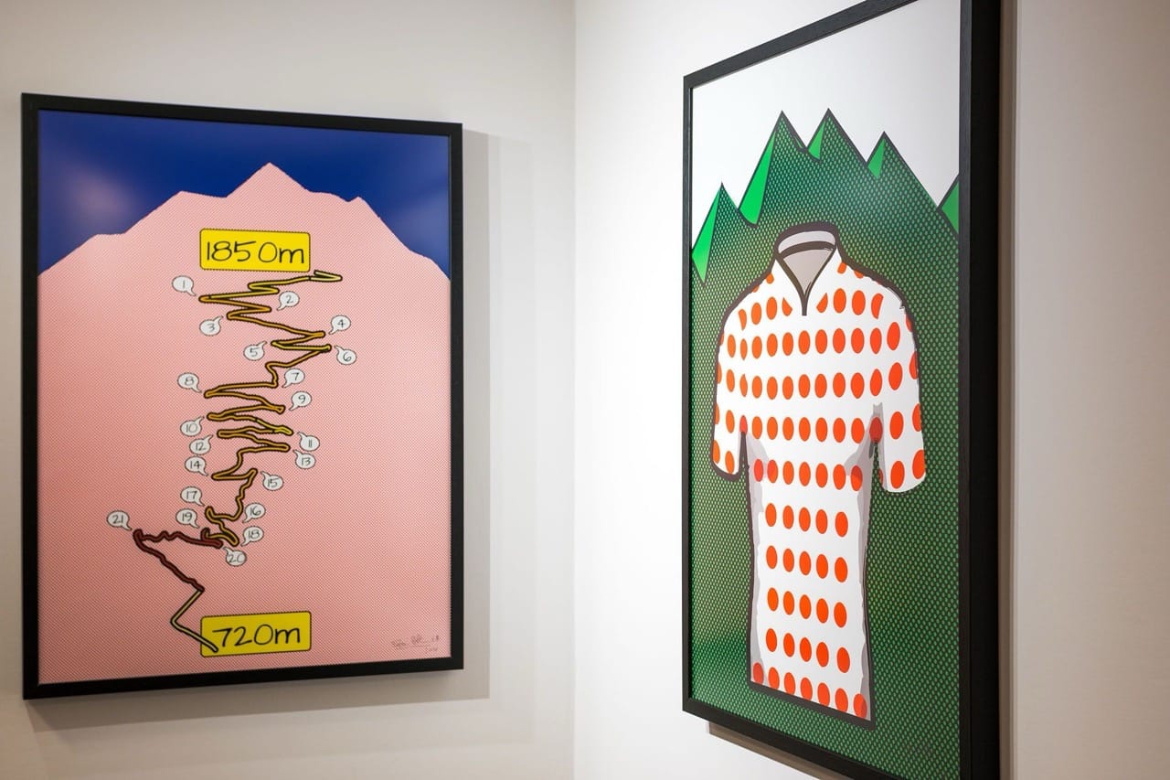 Framed artwork at PopAlp, Alpe d’Huez showing a mountain route and a polka-dot cycling jersey design