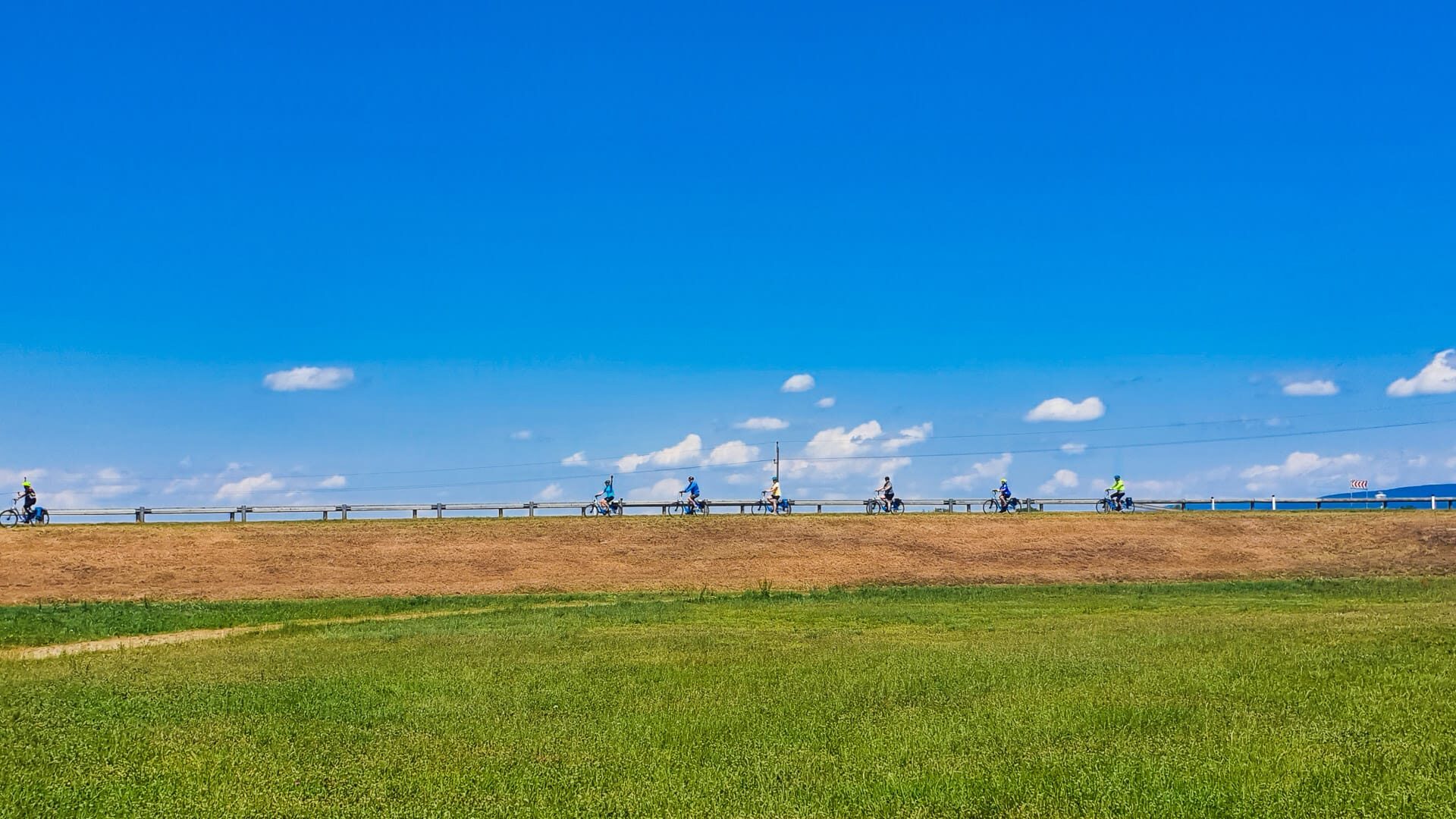 Cyclists on the horizon on a danube bike and boat tour