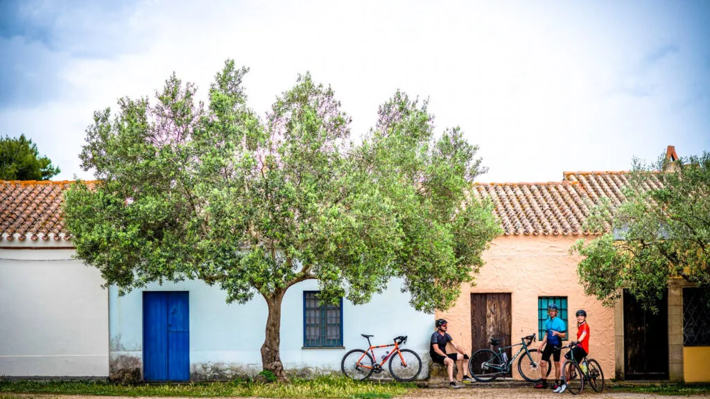 Three cyclist take a breather in sardinia