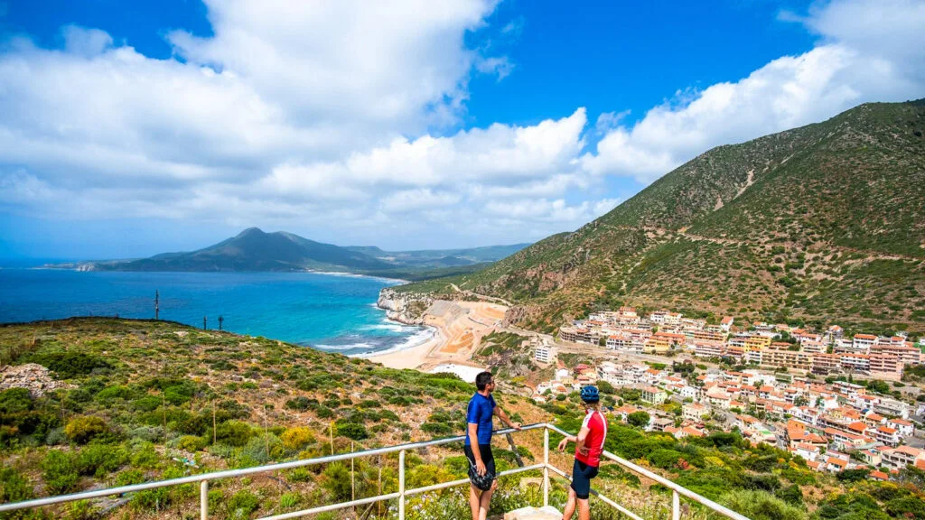 two cyclists admiring the view in sardinia