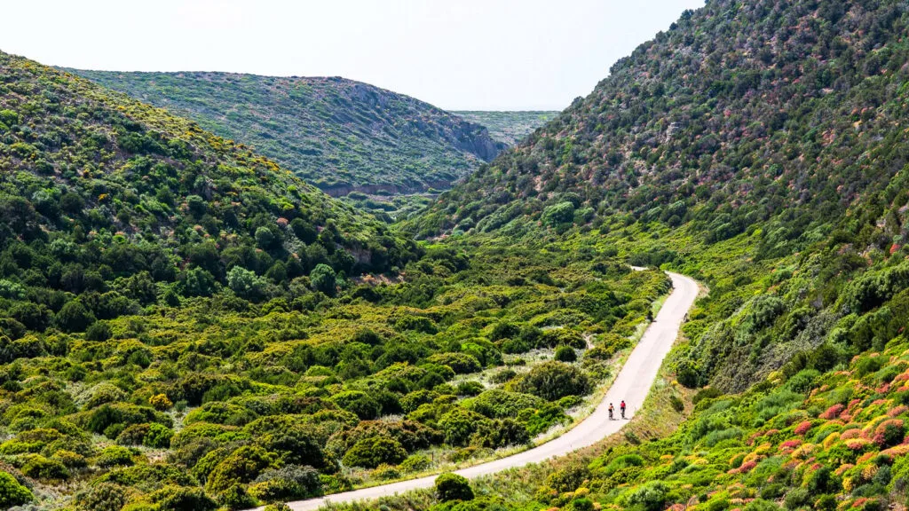 two cyclists in sardinias green central region