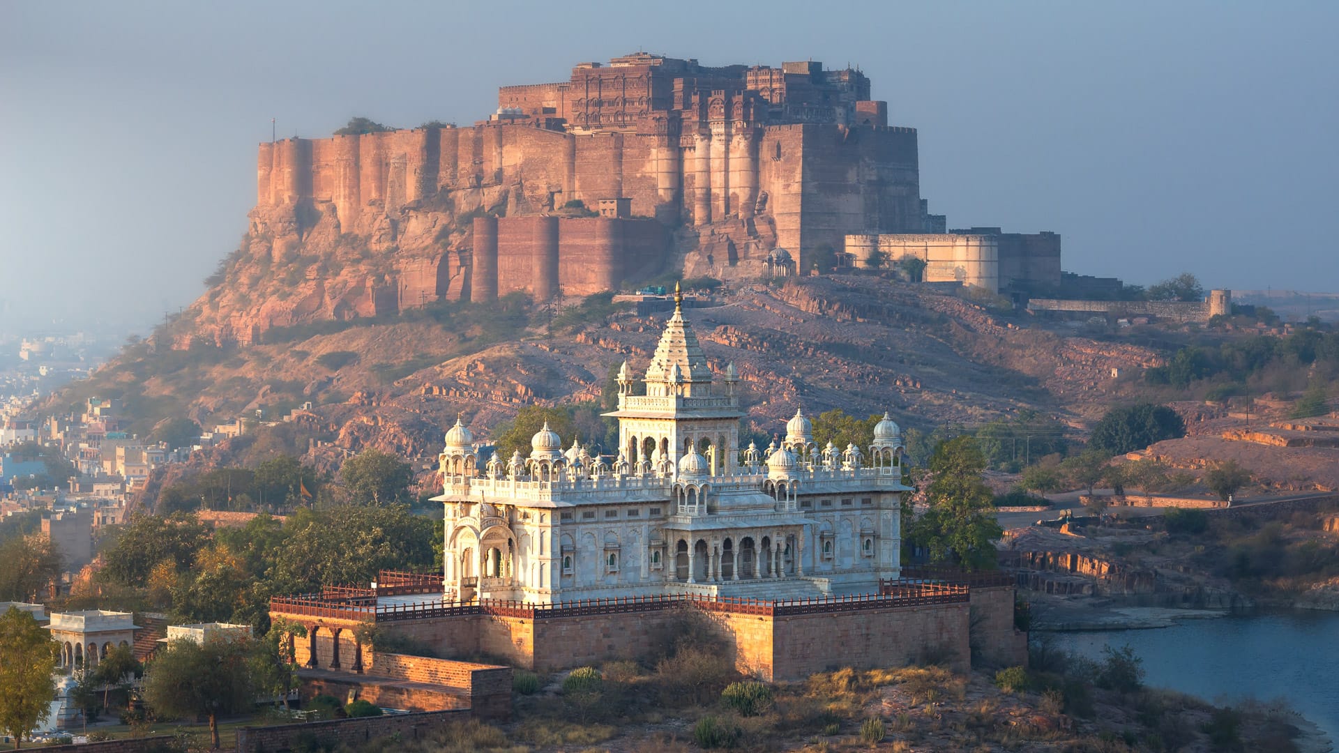 India, Jodhpur, city scape at sunset of Blue city and Mehrangarh Fort a UNESCO World Heritage Site with Jaswant Thada in the foreground.