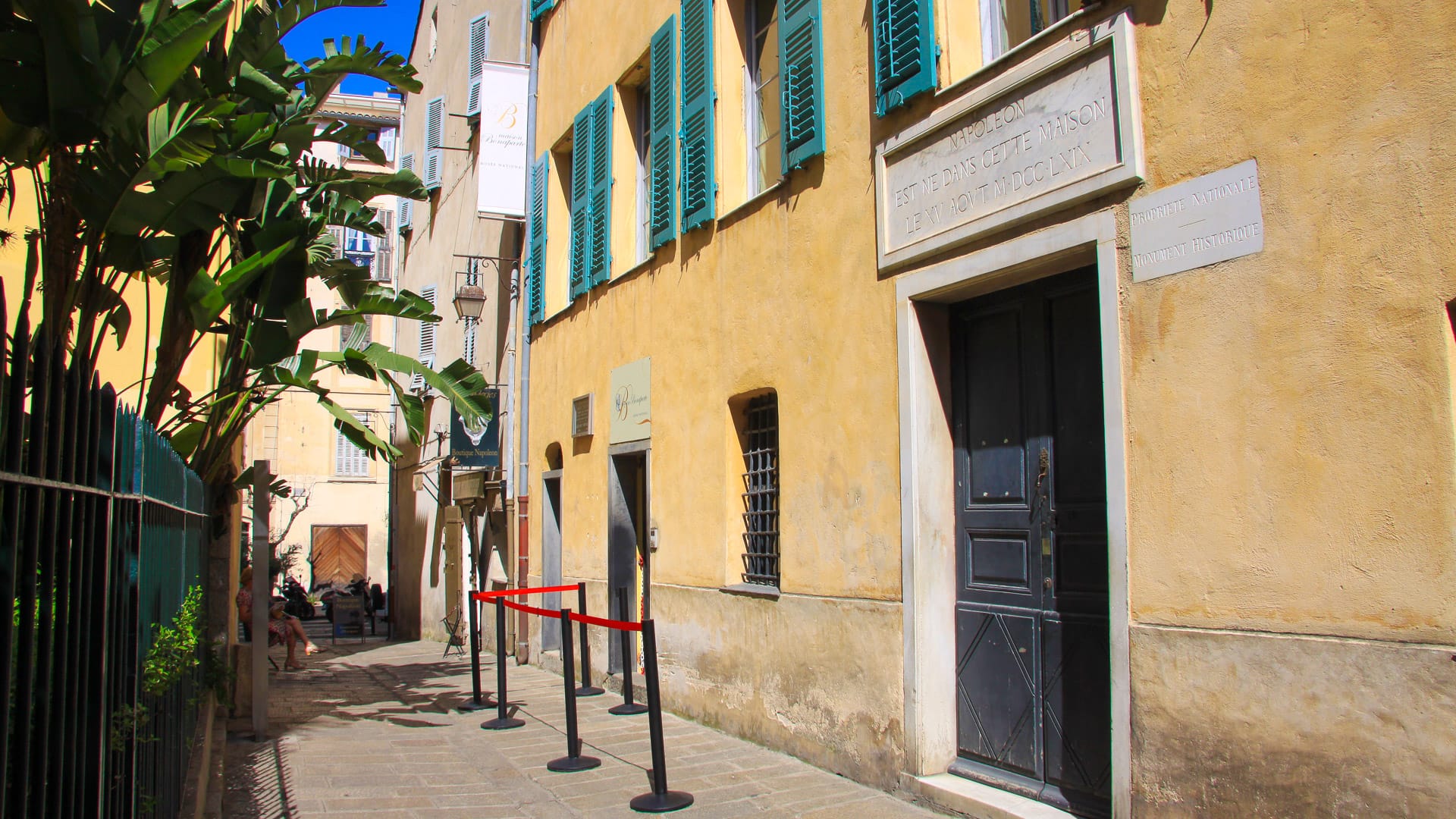 Exterior of Maison Bonaparte with green shutters in Ajaccio, Corsica