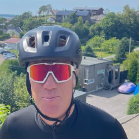 Cyclist Erik Duncan in helmet and sunglasses on a sunny day in Norway