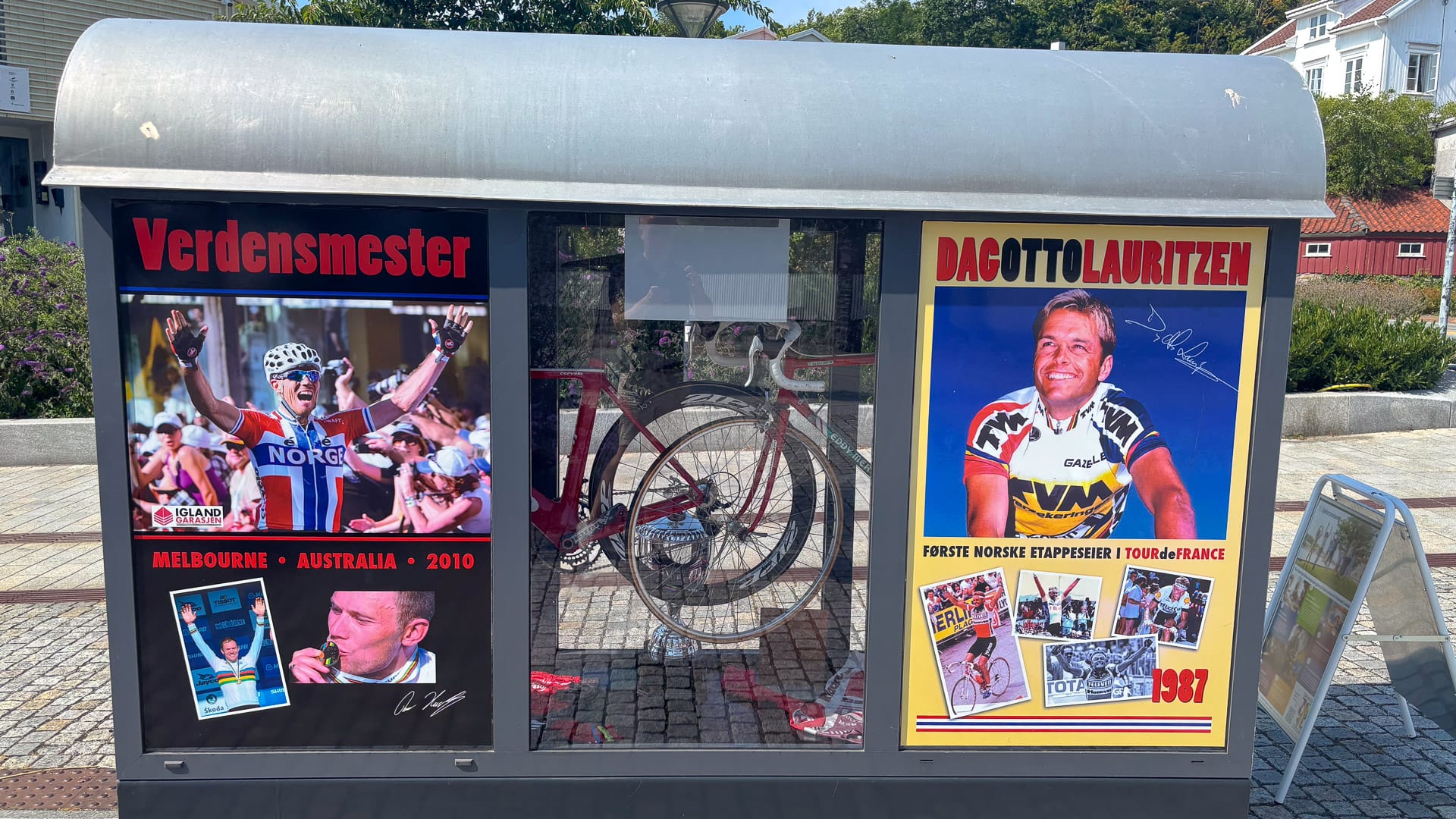 Display case with posters and memorabilia celebrating Dag Otto Lauritzen and Thor Hushovd