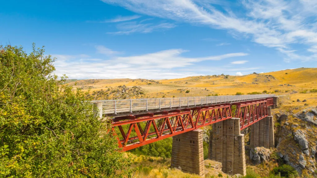 Old railway bridge on the Otago Central Rail Trail crossing a rocky gorge in Central Otago, New Zealand