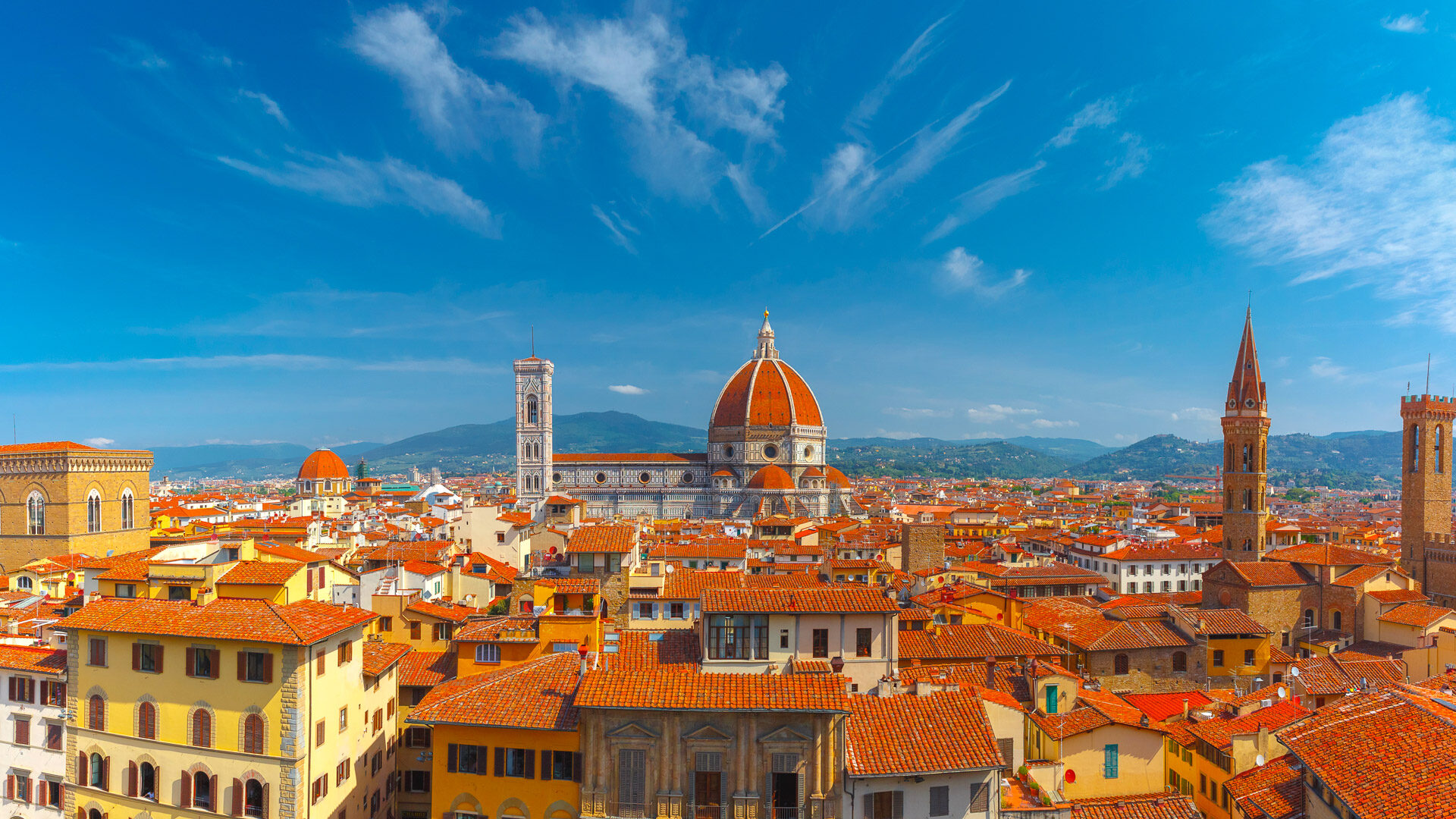 Panoramic view of Florence skyline with red rooftops and Duomo