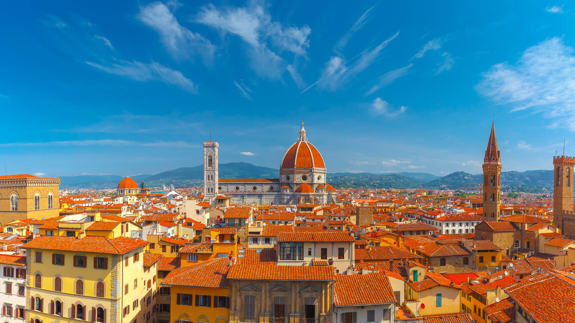 Panoramic view of Florence skyline with red rooftops and Duomo