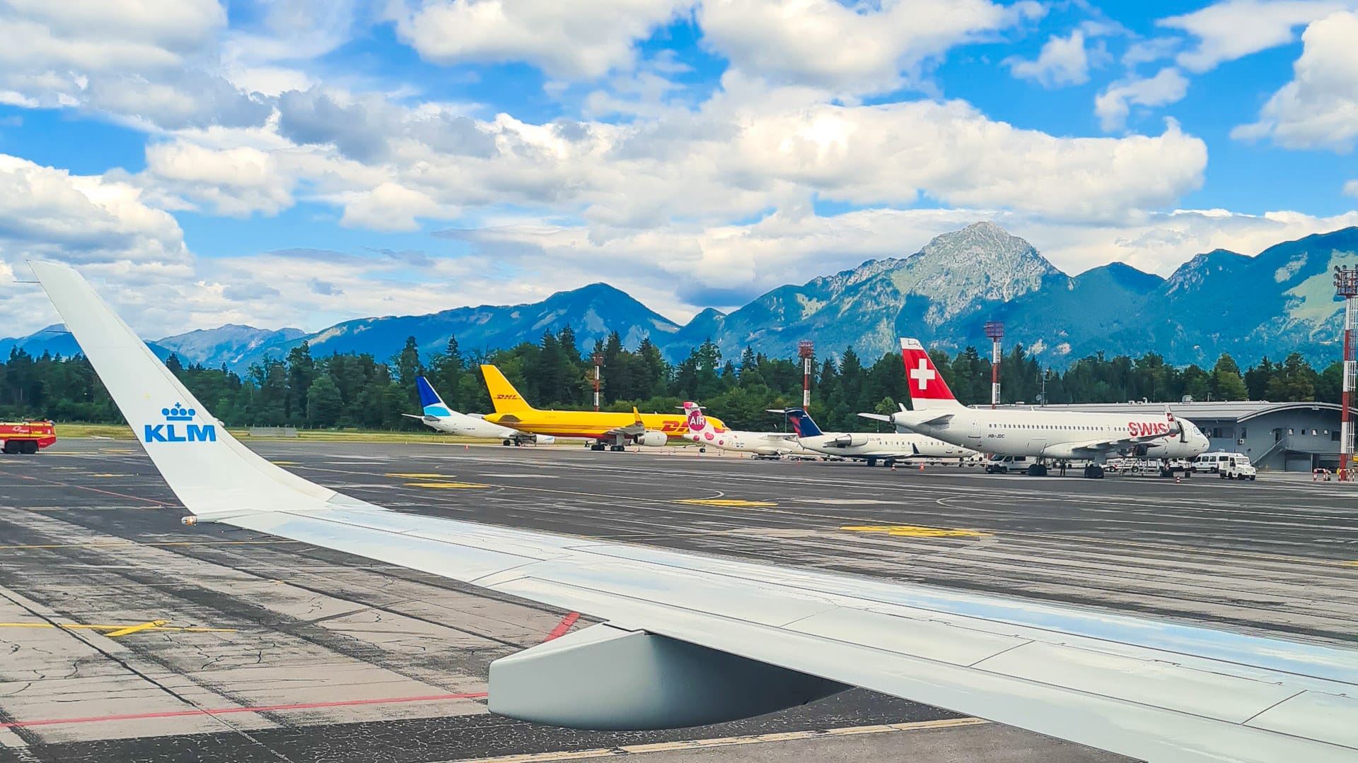 Ljubljana airport with planes overlooking the mountains