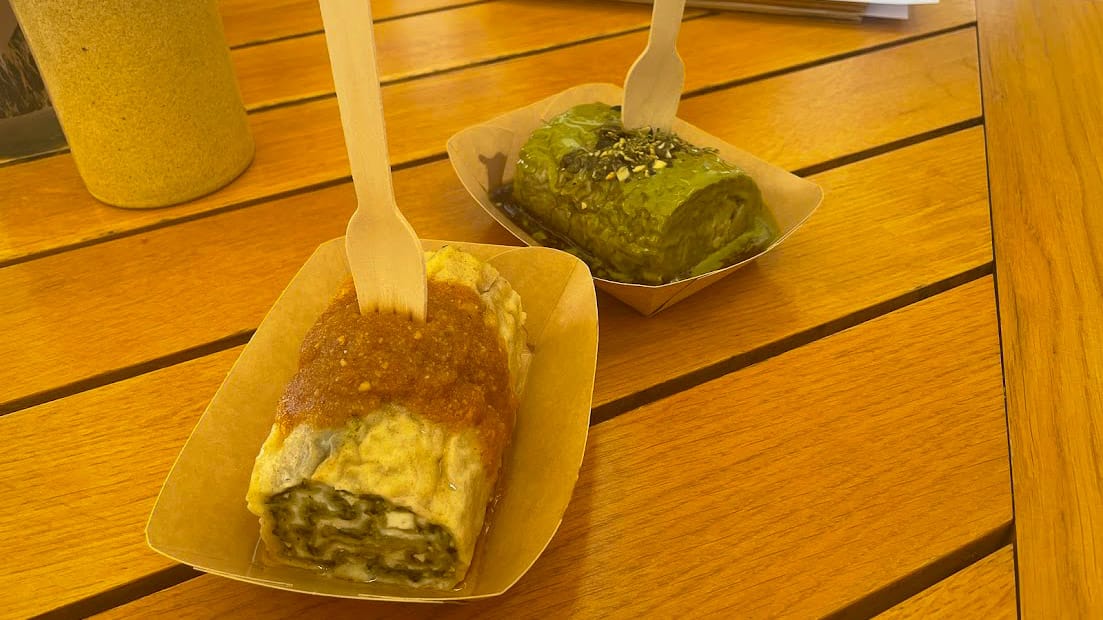 Traditional Slovenian dumplings with savoury fillings served on wooden table