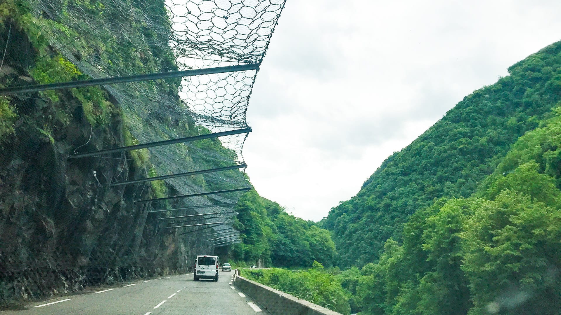Rockfall protection nets over cliff road to Col du Tourmalet