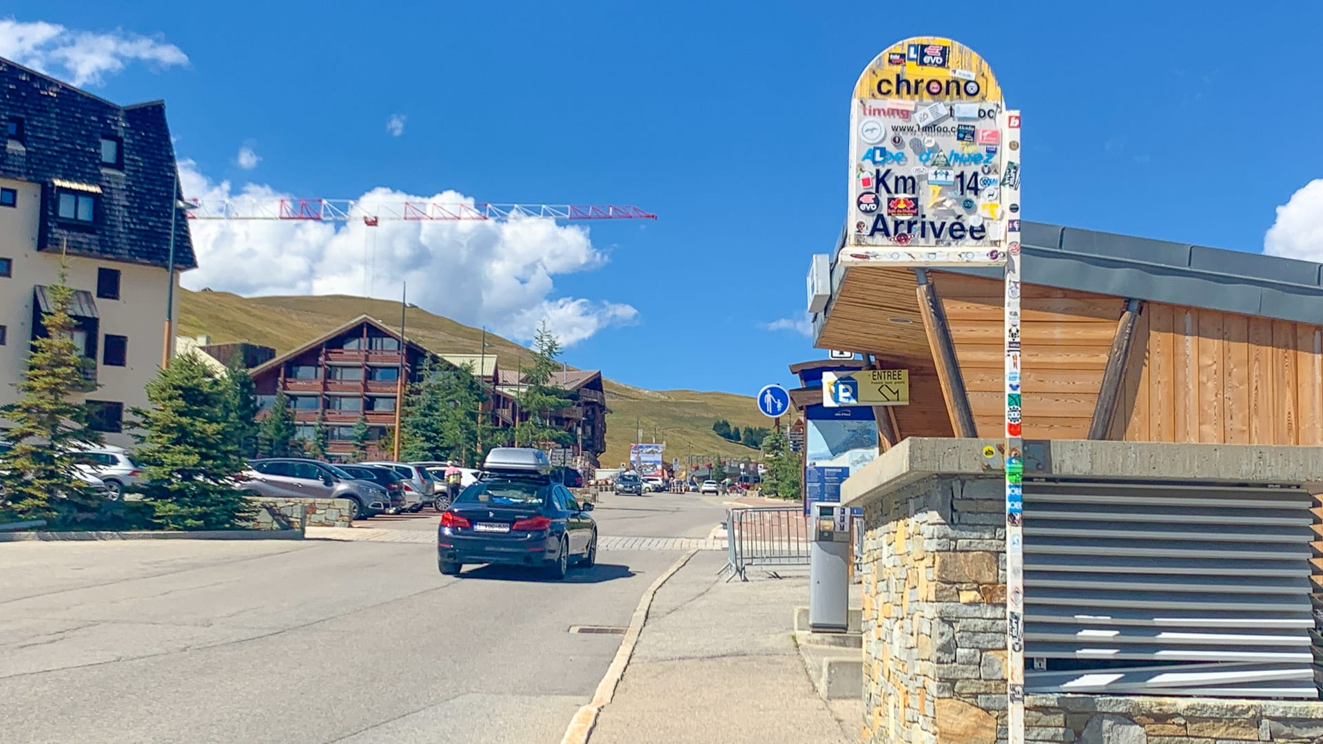 Mountain road sign marking routes through alpine villages