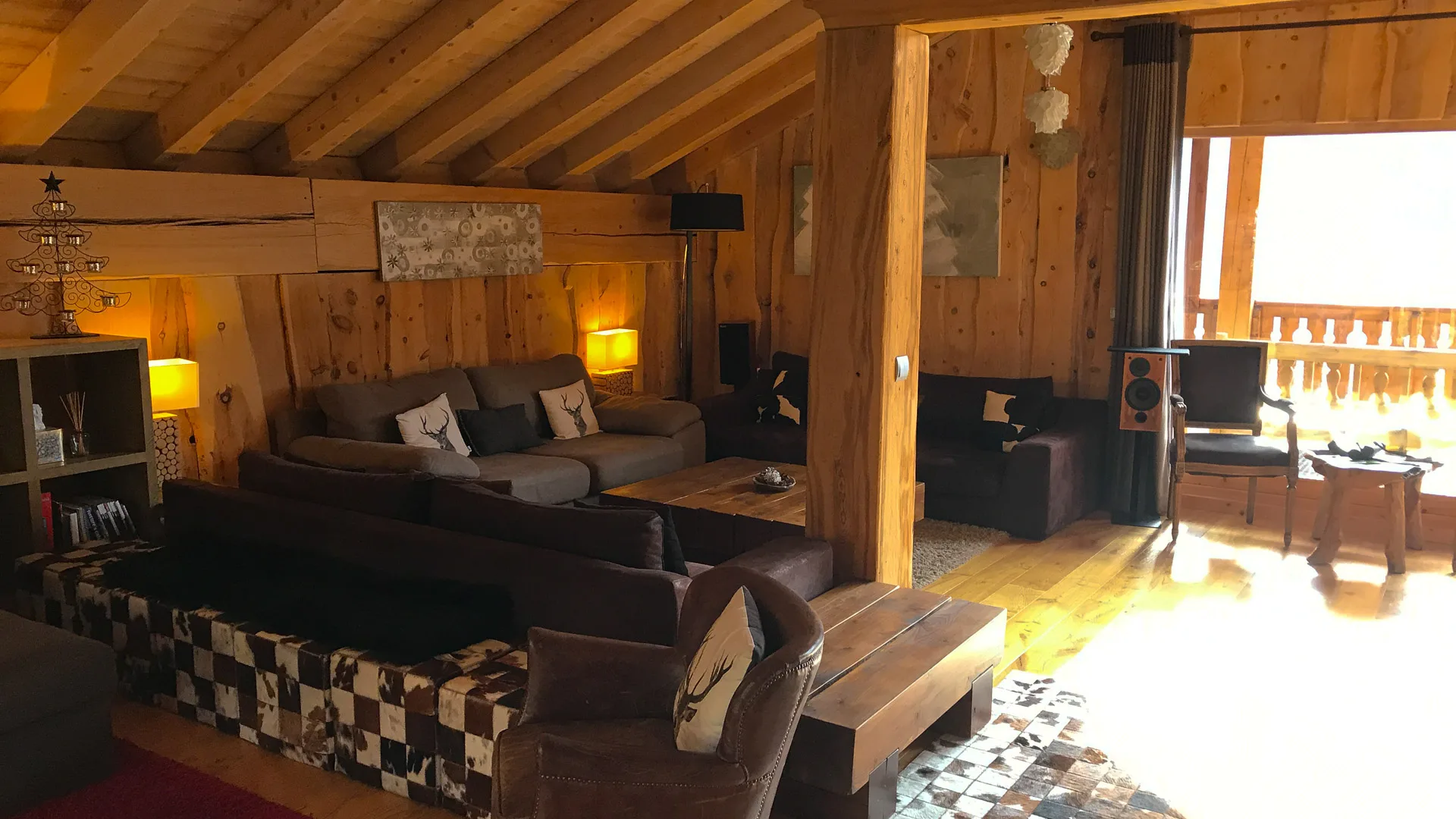 Cozy rustic living room in The Peak, Sainte Foy Tarentaise, featuring wooden walls and ceiling