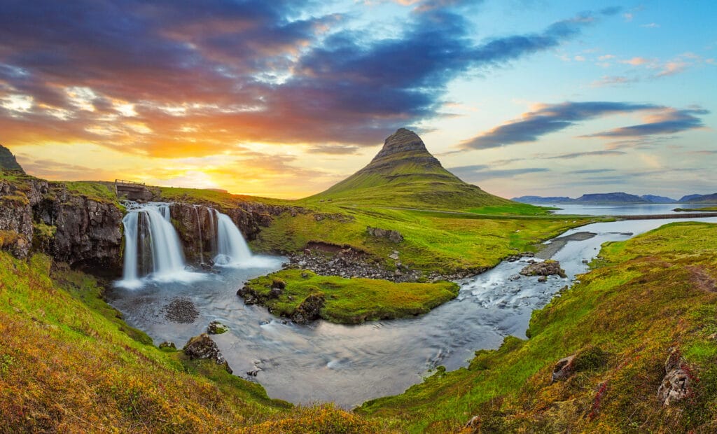Waterfall and mountain seen from an Iceland cycling tour