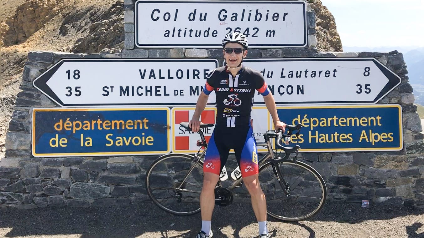 Cyclist at top of Col du Galibier