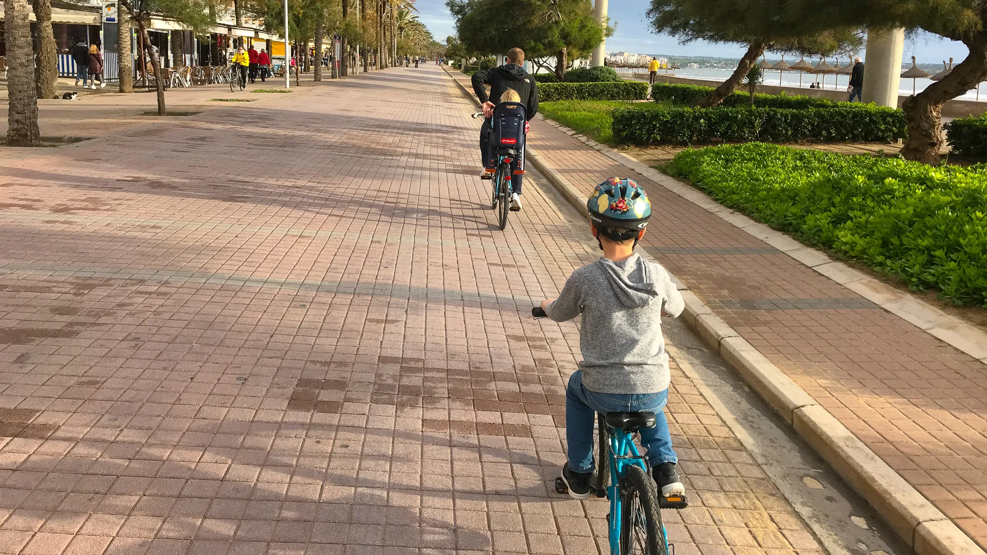 Children cycling along bike path in Palma