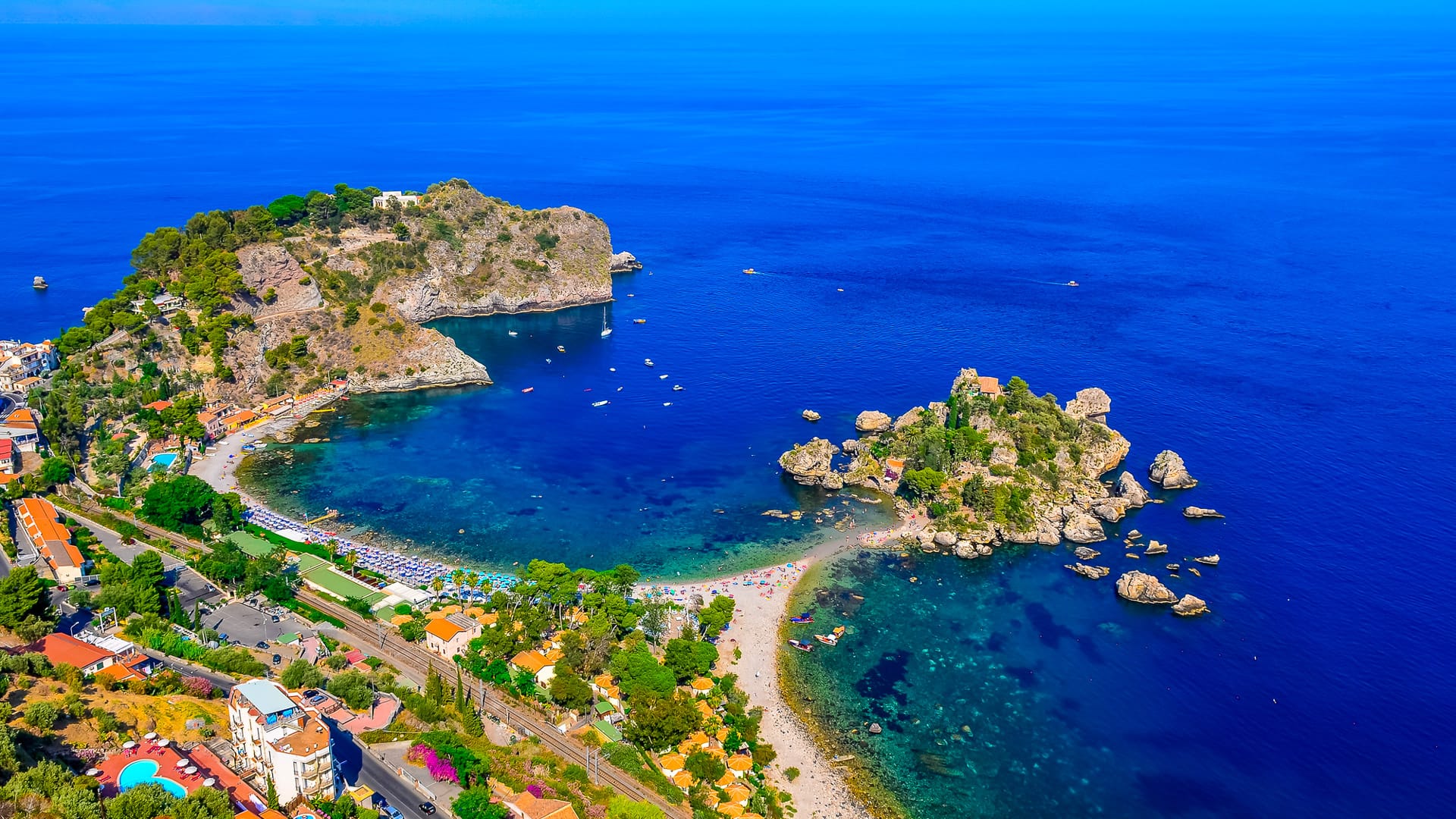 Aerial view of Isola Bella beach coast in Taormina, Sicily, Italy