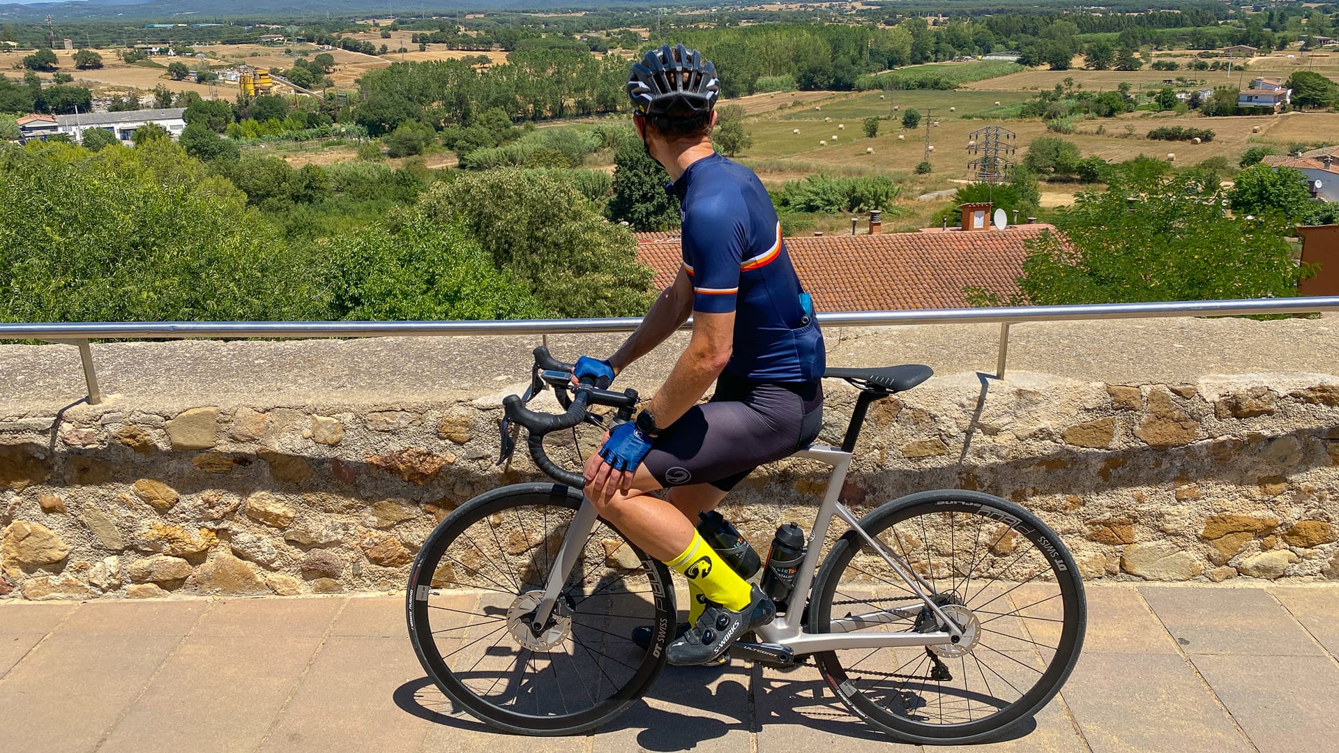 Cyclist admiring the view in Les Gavarres region of Costa Brava