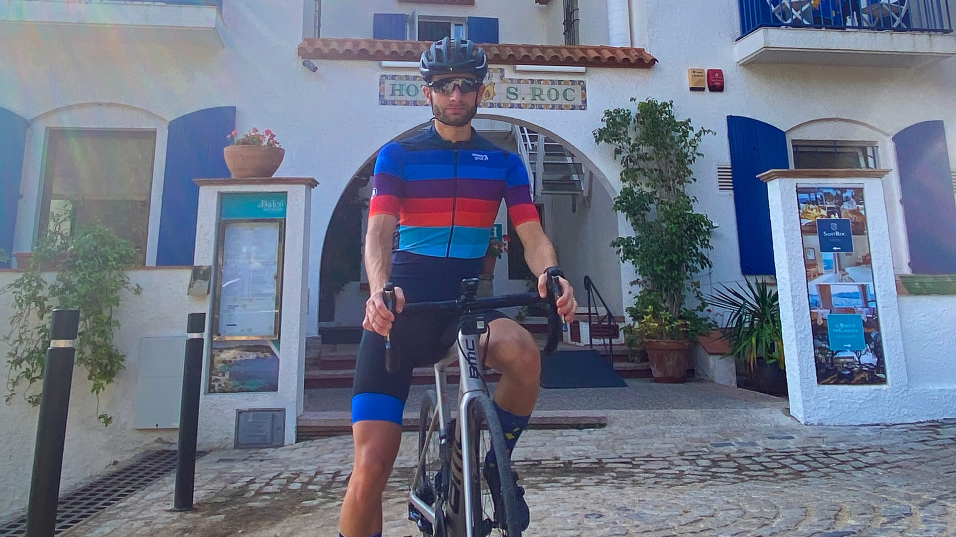 Hotel San Roc with cyclist in front