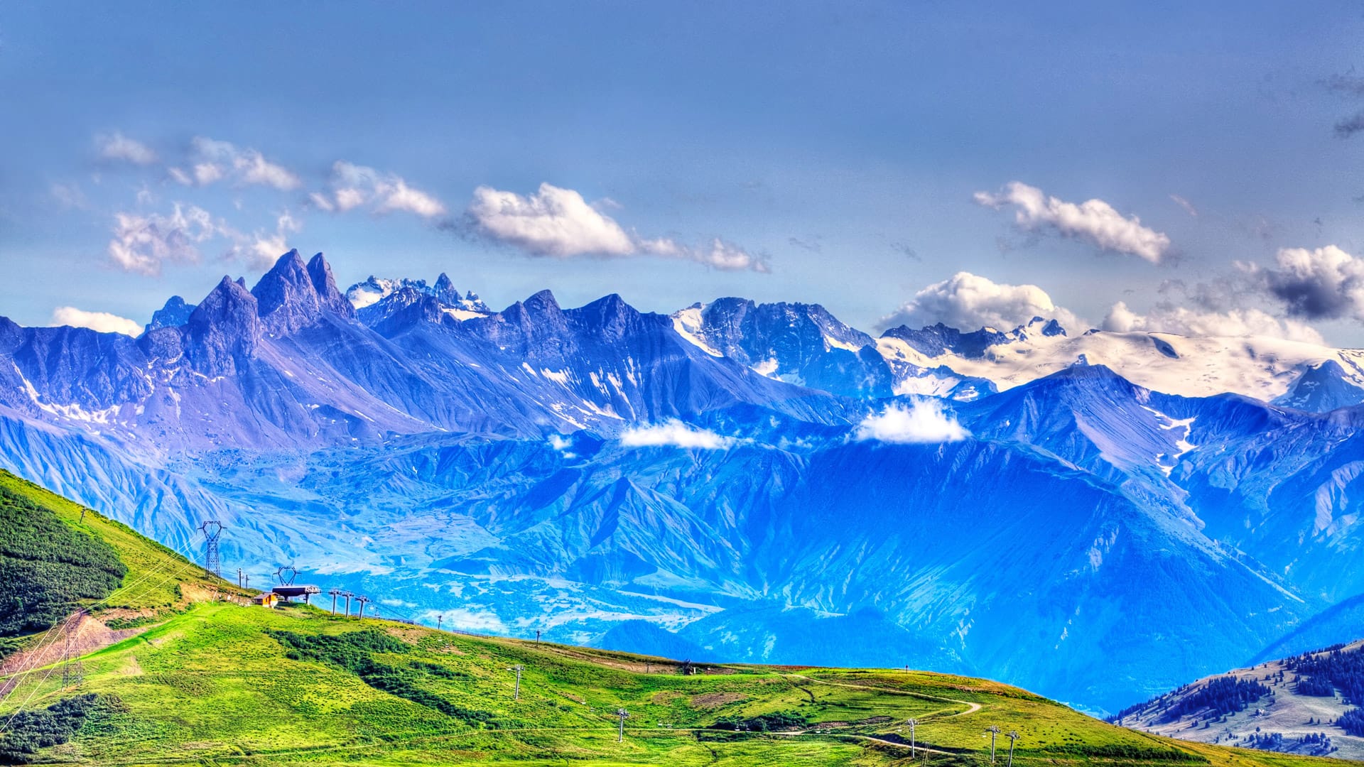 Beautiful landscape with high altitude peaks in The Alps as it can be seen from the mountain pass Madeleine (Col de la Madeleine) in France.