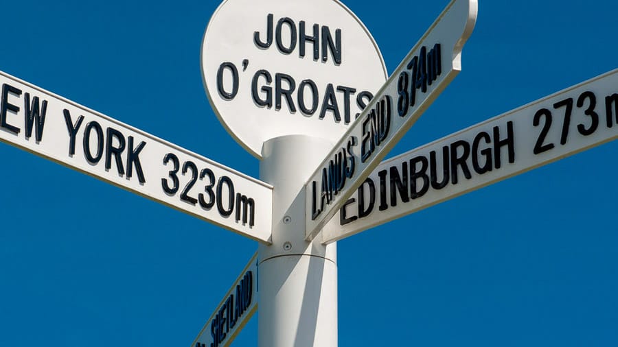 The milepost sign at John O Groats in Scotland on the most north eastern tip of the UK