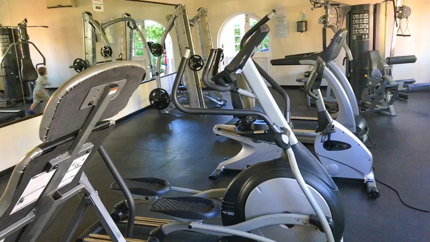 Gym with cardio and weight machines at a Barbados beachfront hotel