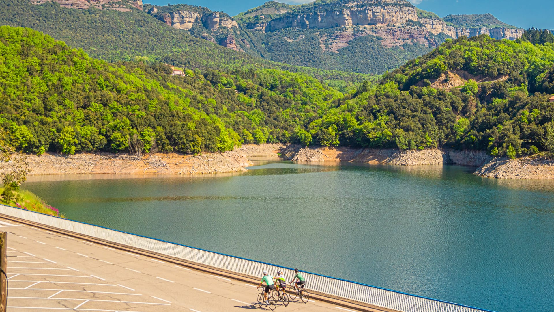 Cyclists near a lake in the Osona region near Barcelona, Spain