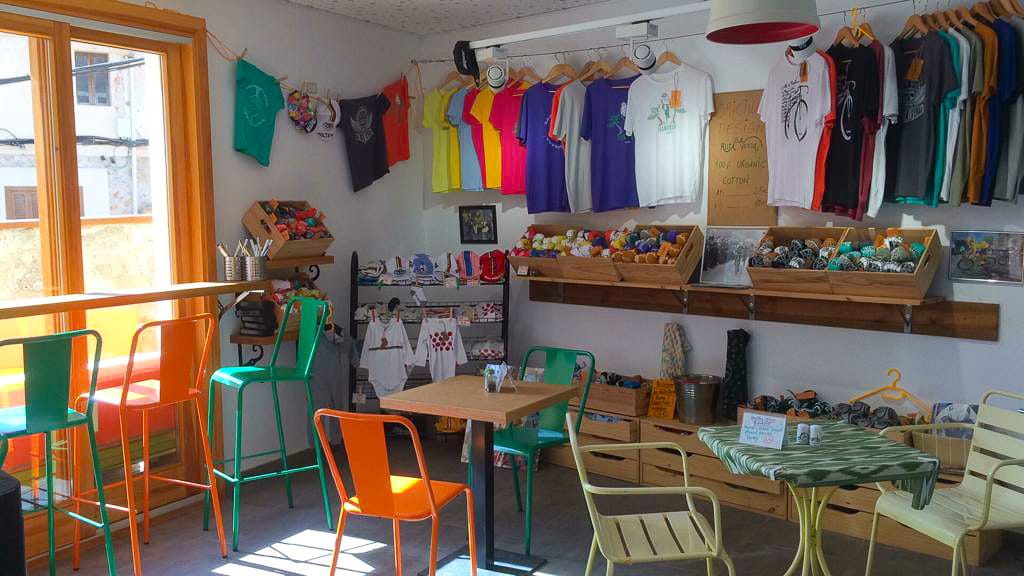 Colourful cycling café interior with jerseys and gifts on display in Mallorca