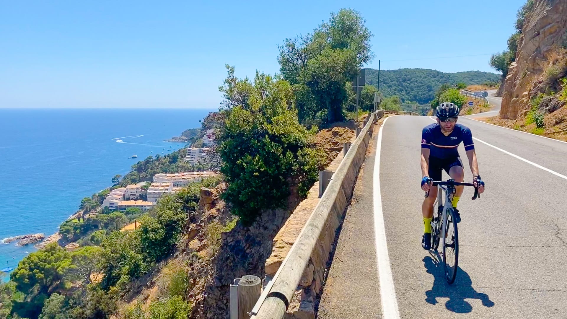 Road winding down the Costa Brava coastline near Tossa del Mar, Catalonia, Spain