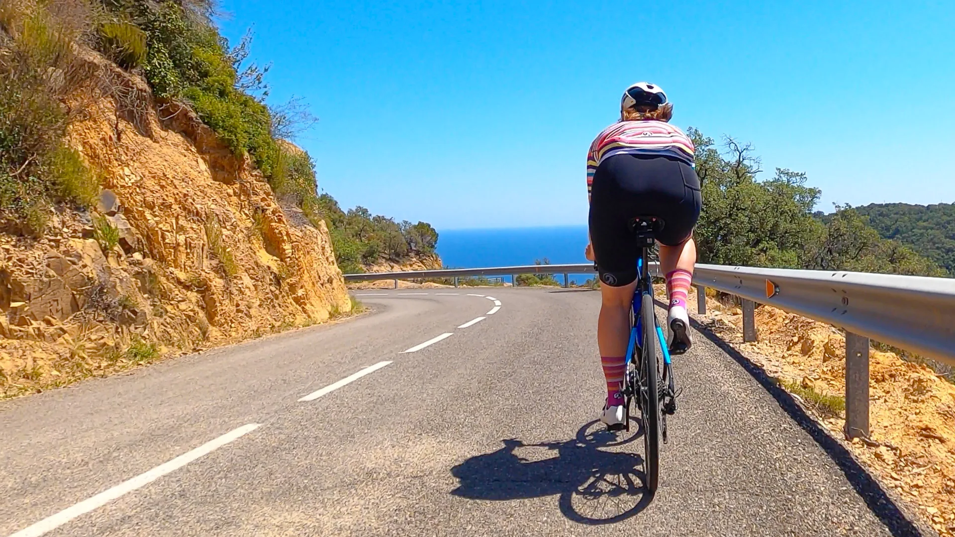 Cyclist by the sea in Costa Brava