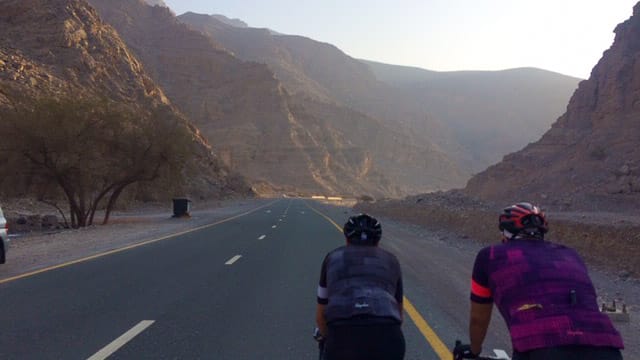 Cyclists cycling through Jebel Jais mountains, UAE