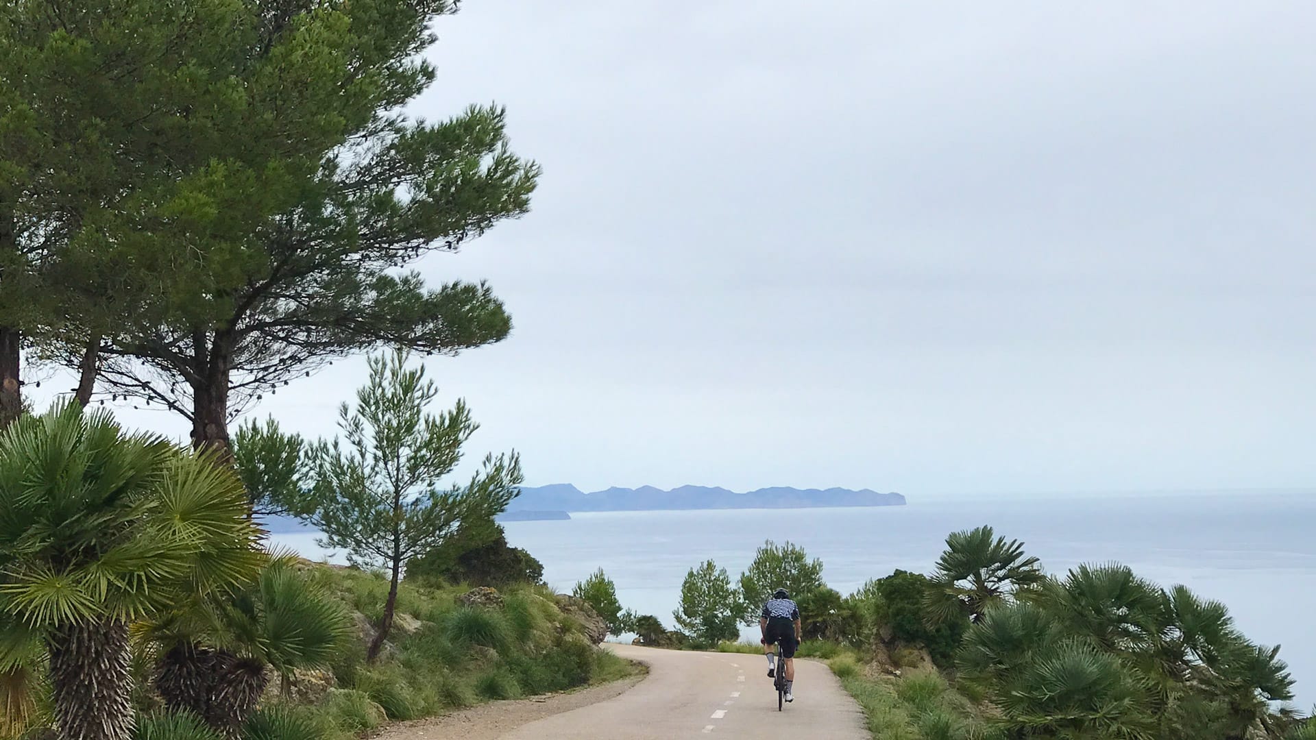 Cyclist on road to Ermita de Betlem, one of Mallorca's best cycling climbs
