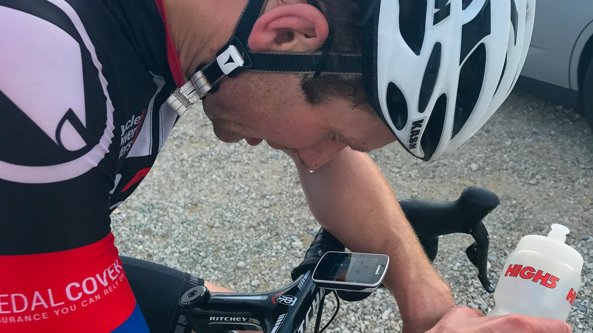 Exhausted cyclist at the top of Mare de Deu del Mont, Girona