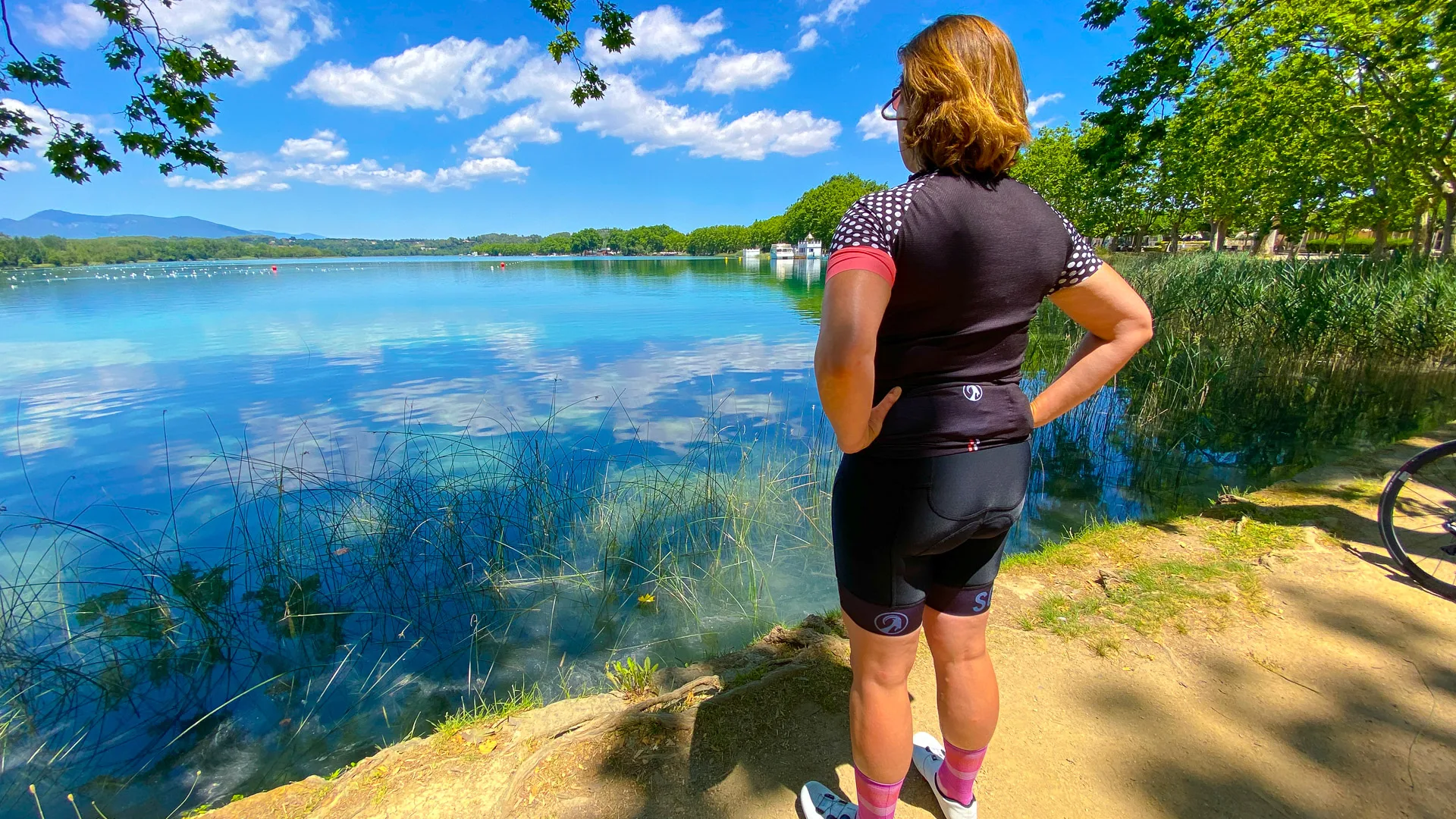 Cyclist looking at Lake Banyoles