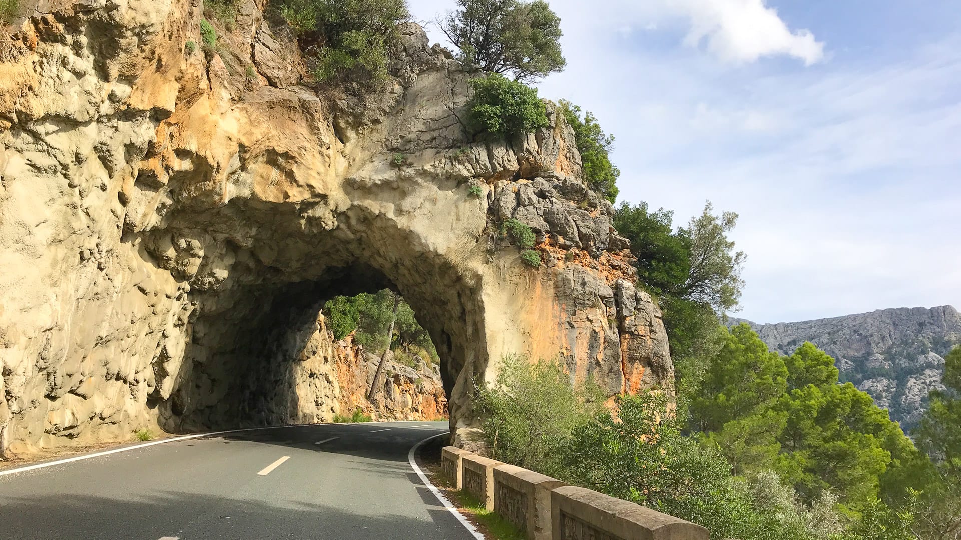 Entrance of the Puig Major tunnel in Mallorca surrounded by rocky mountain landscape