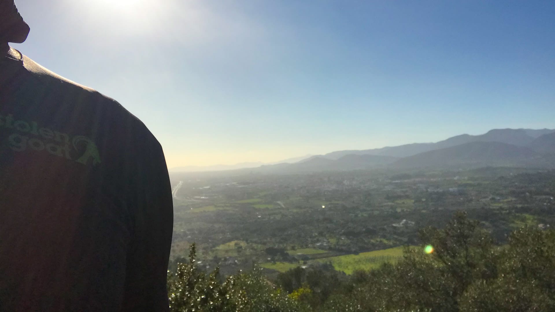 Cyclist with view from Puig Santa Magdalena Mallorca behind