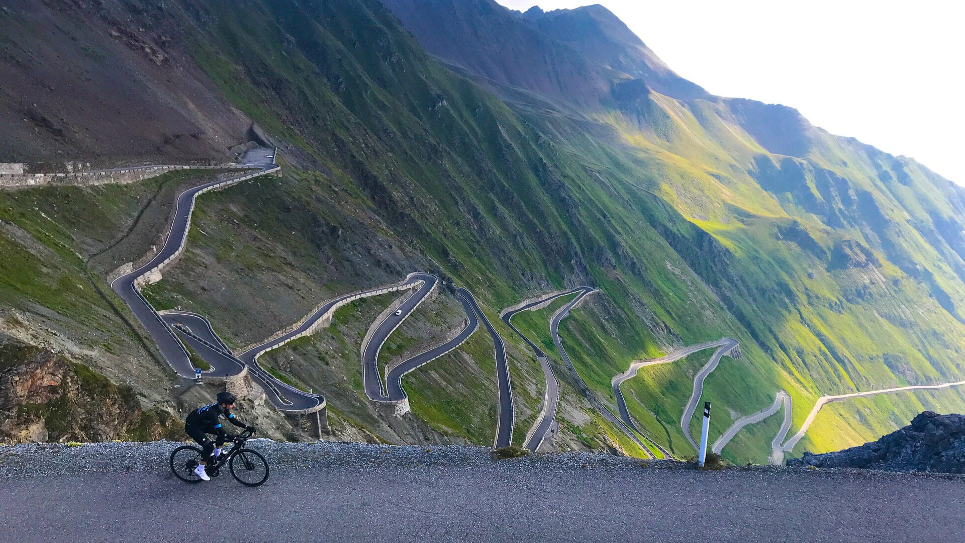Stelvio Pass cycling at summit having cycled from Bormio