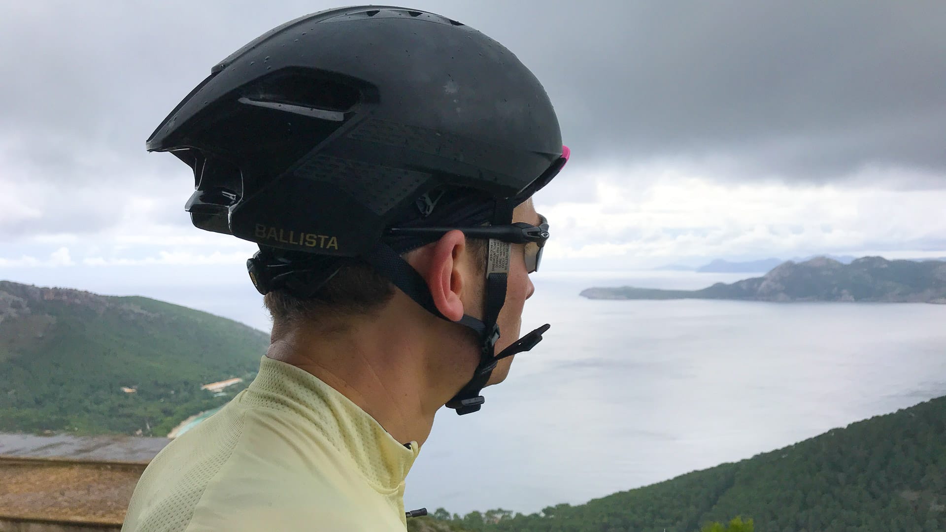 Cyclist admiring the view from pepperpot on the Cap de Formentor cycle route