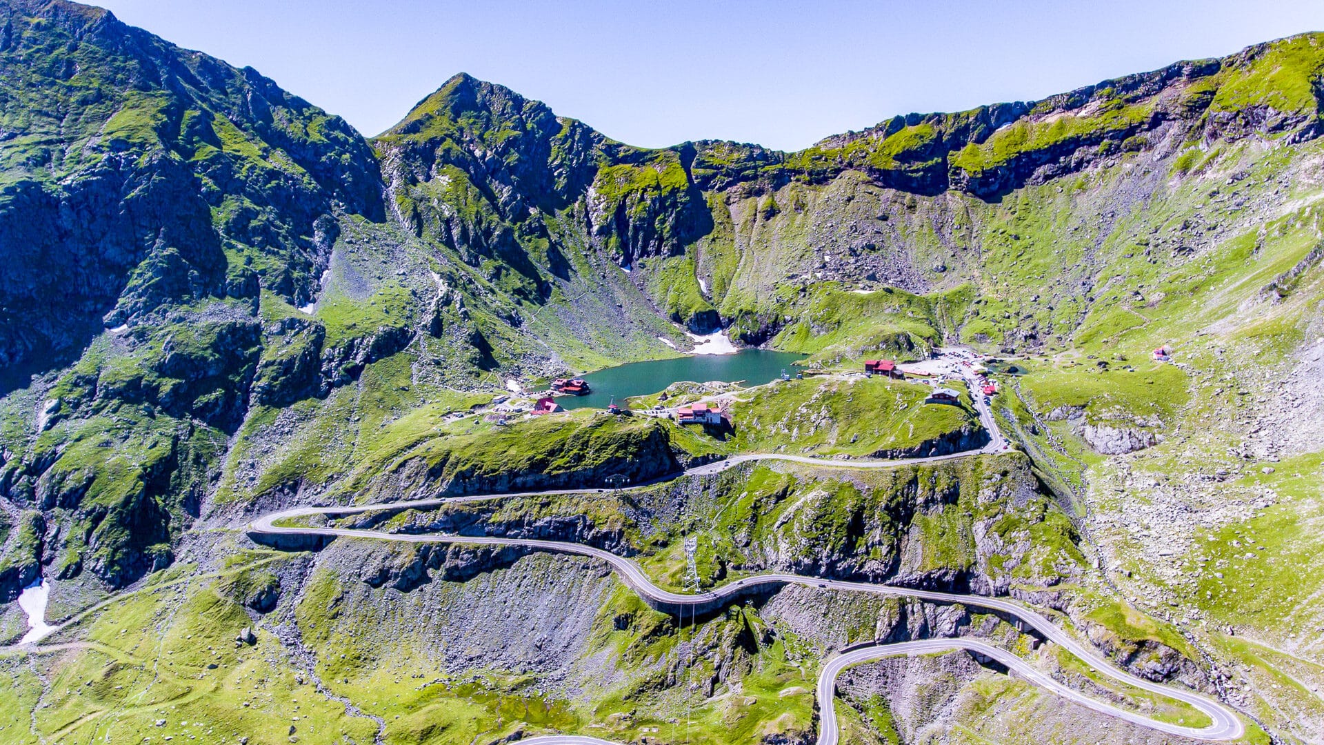 Panorama of Transfagarasan highway which crosses Fagaras mountain range at 2,034 meters altitude with Balea glacier lake in Carpathian mountains, Romania.