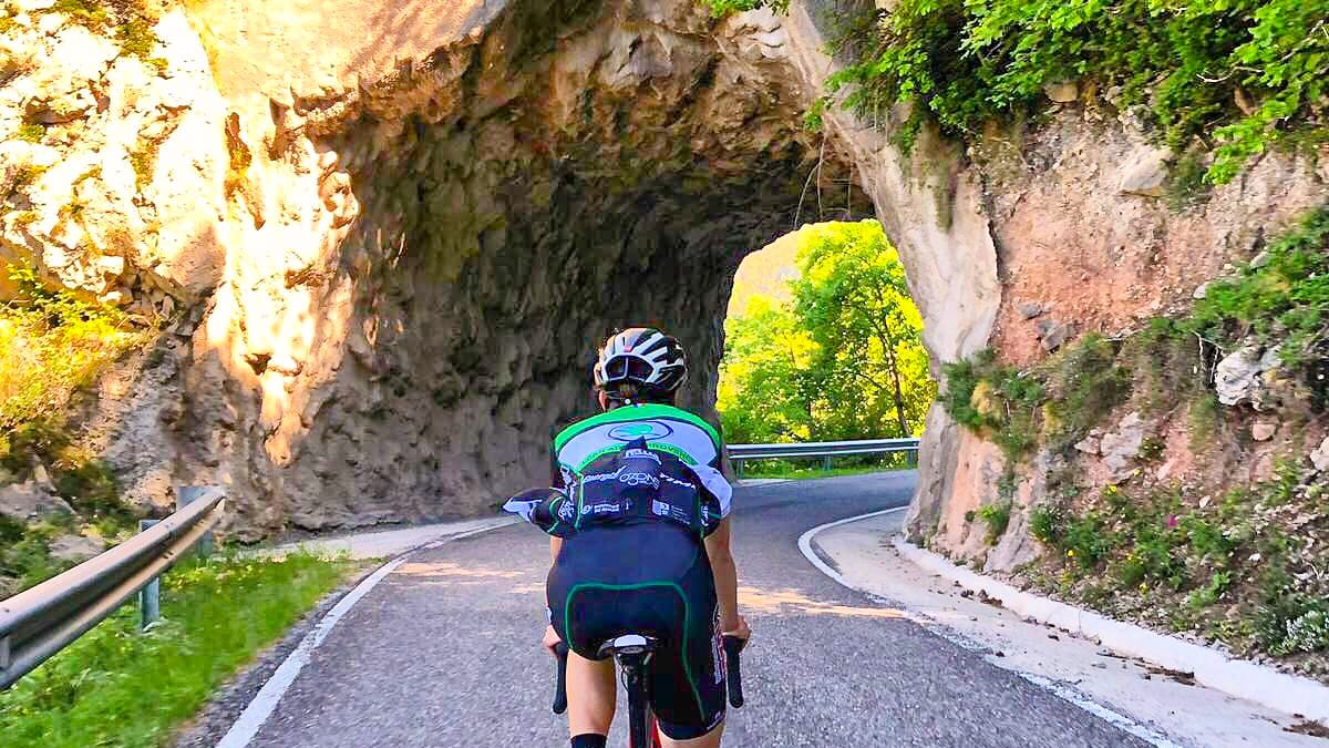 Cyclist climbing by bike Catalunya