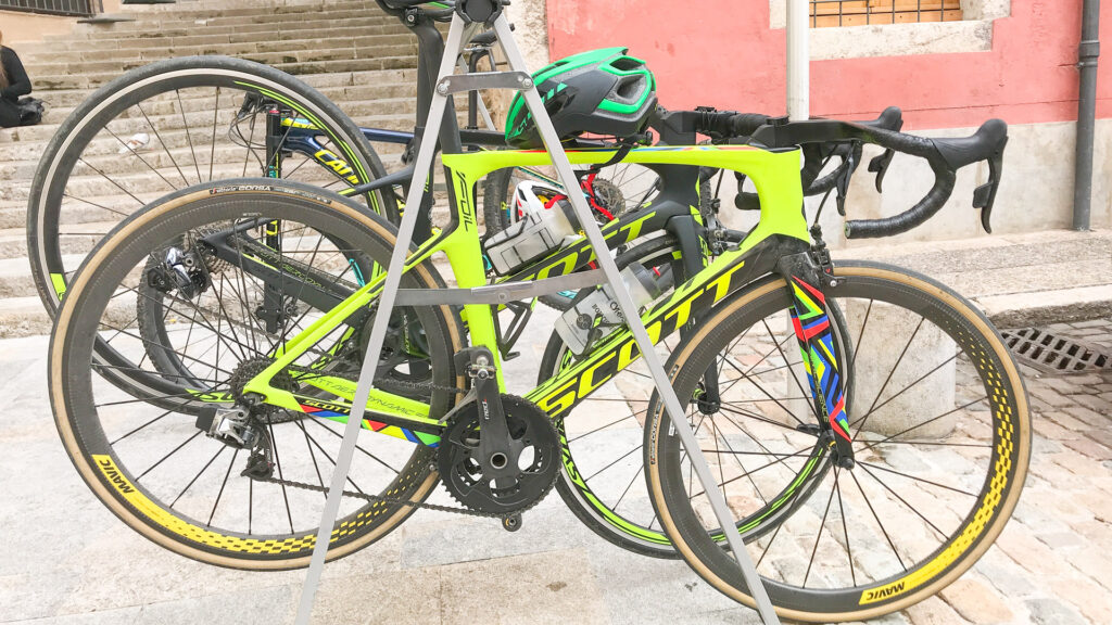 Tips for cycling Girona - bikes parked in a bike stand in old town Girona