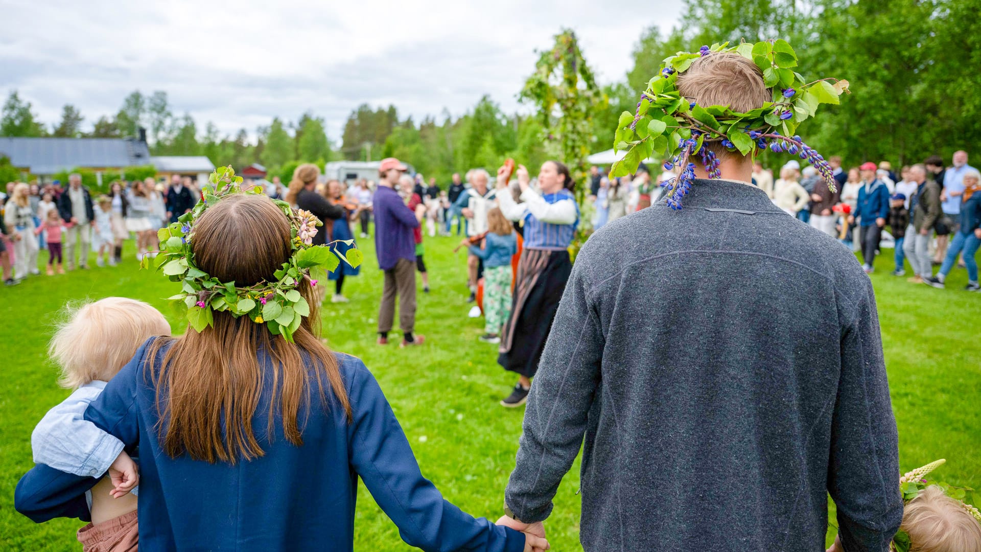 People wearing flower crowns at Swedish midsummer celebration during MSR 2025
