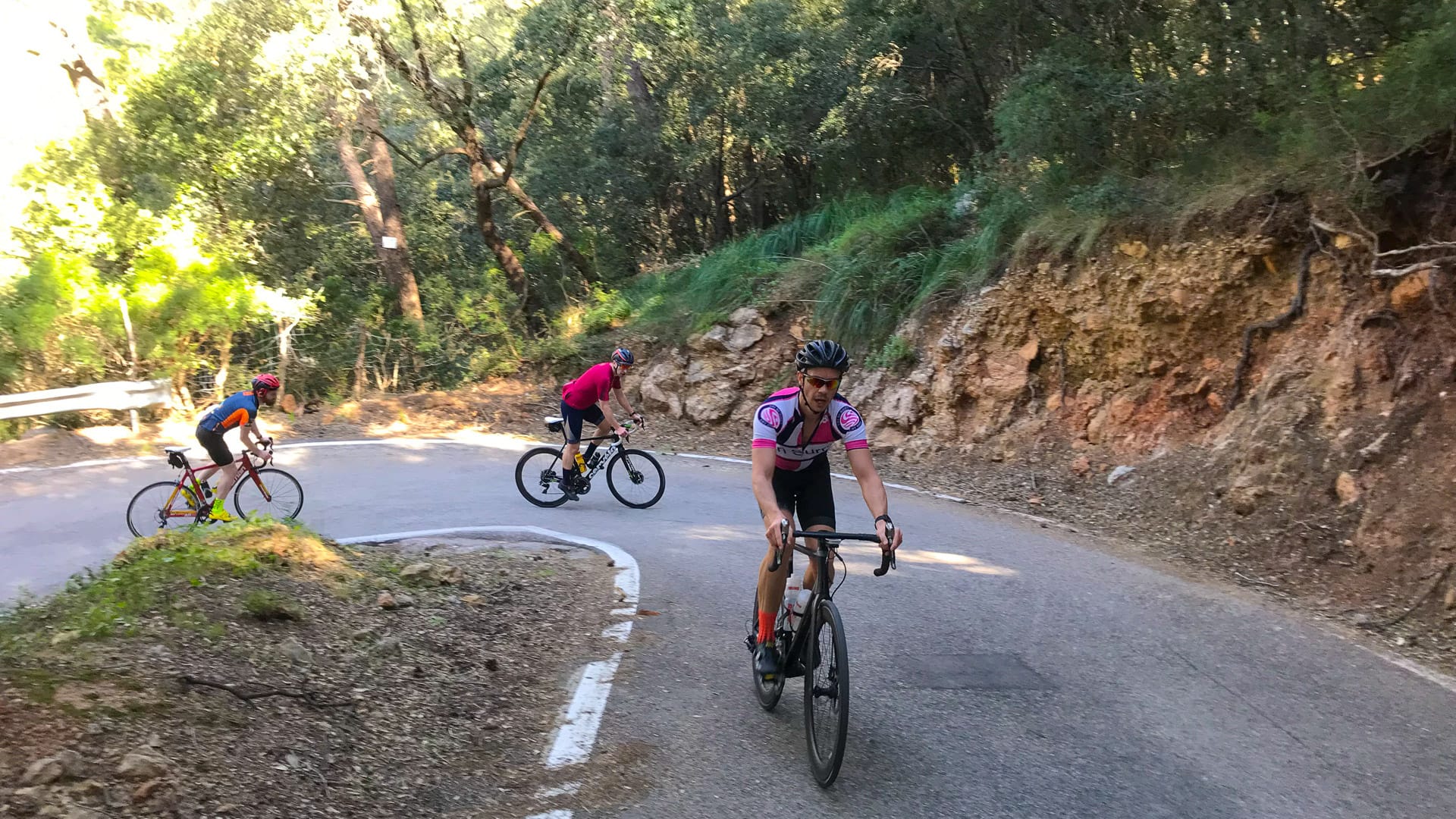 Cyclists climbing up hairpin on mallorca 312 route