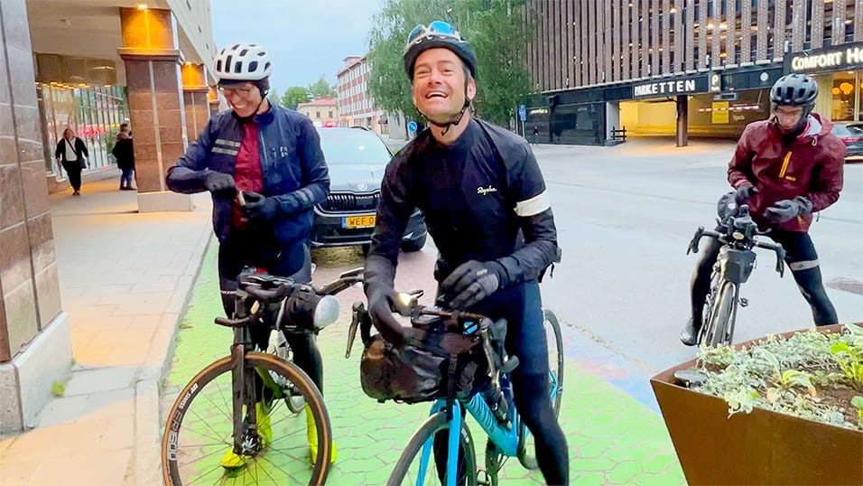 Cyclists stopping in central Umeå during the Midnight Sun Randonnée in Västerbotten Sweden