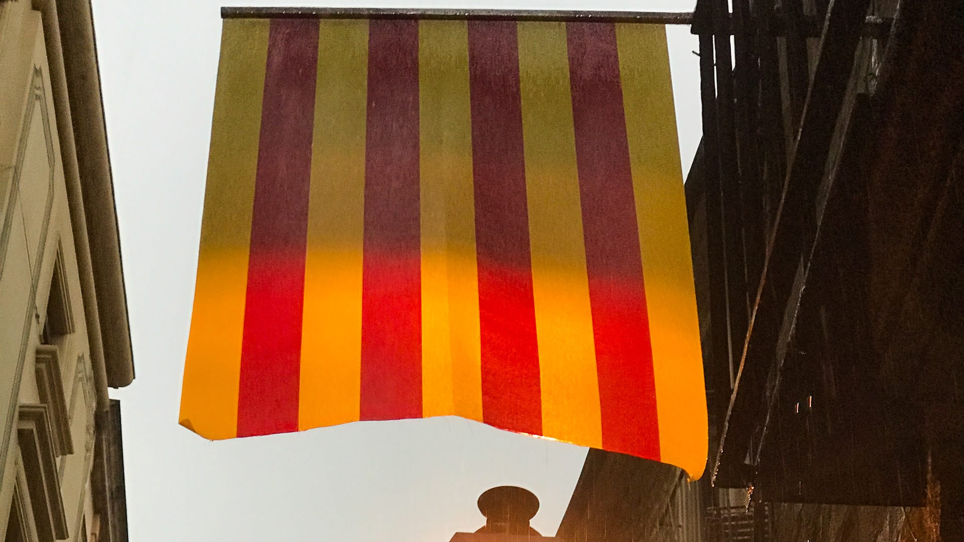 Catalan flag hanging between buildings in Girona’s historic quarter
