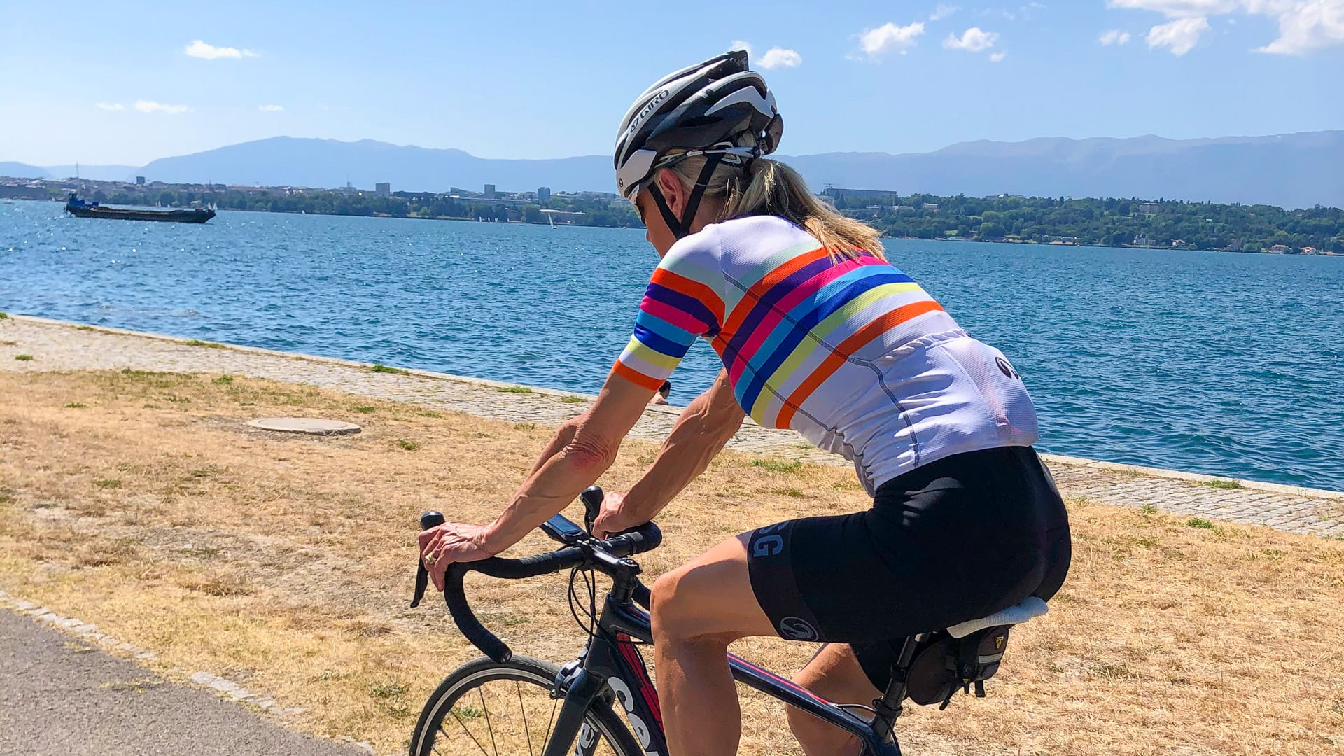 Cyclist approaching Geneva on the Tour du Lac Leman cycling route