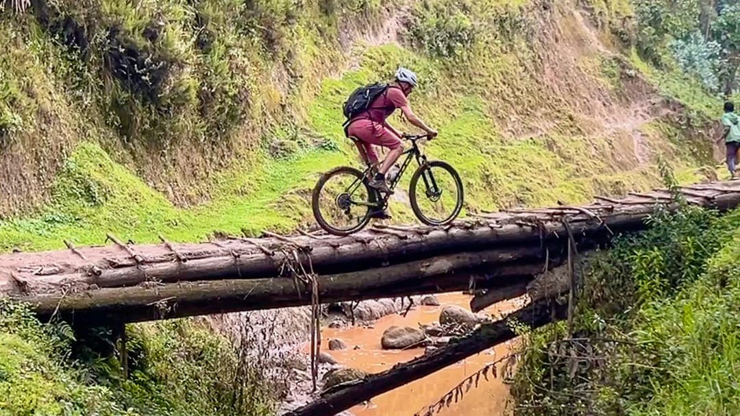 Cyclist tackling a narrow bridge on a recce trip in Hadya