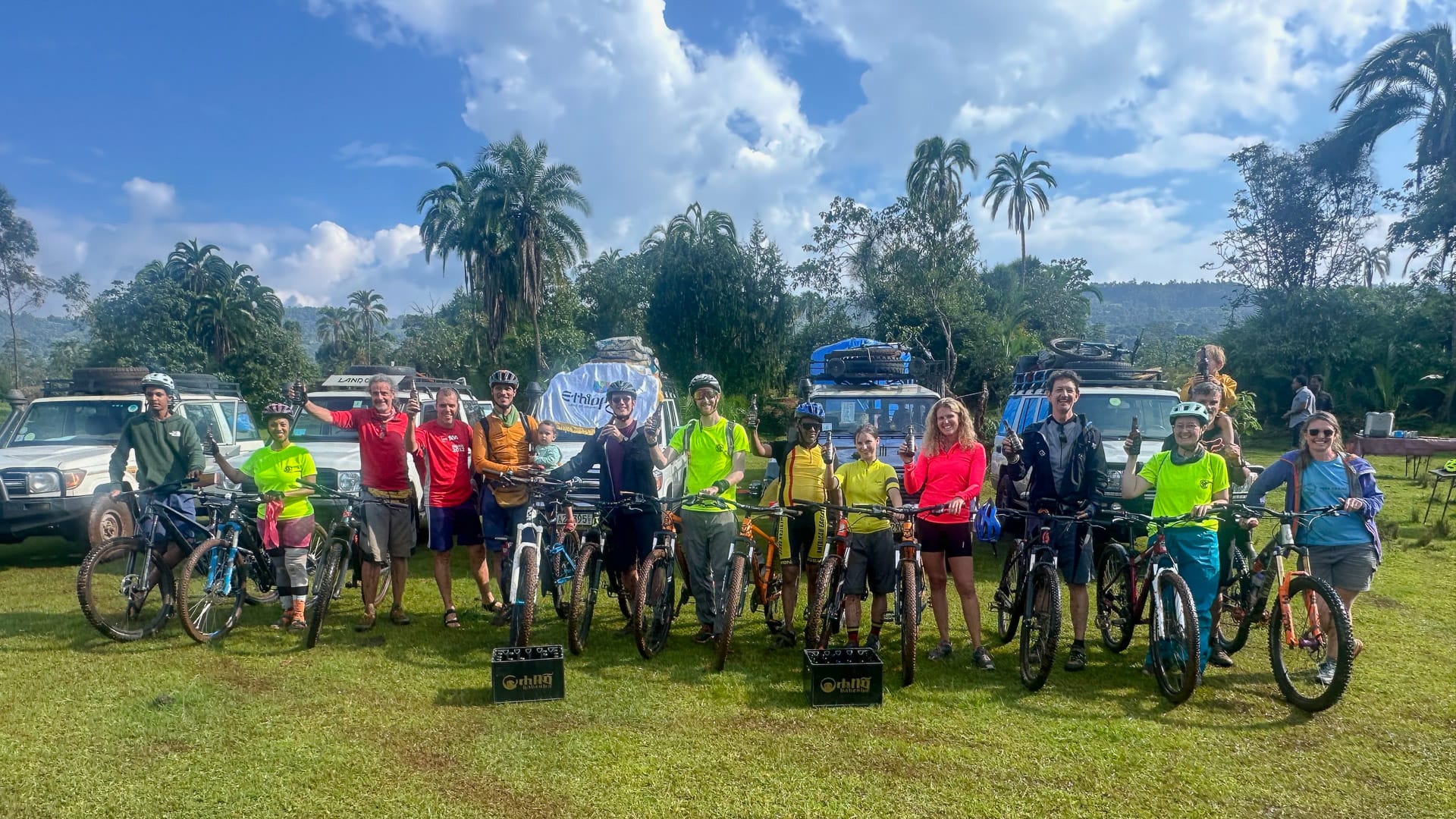 Group of cyclists gathered with bikes at the start of a guided cycling trip in Ethiopia