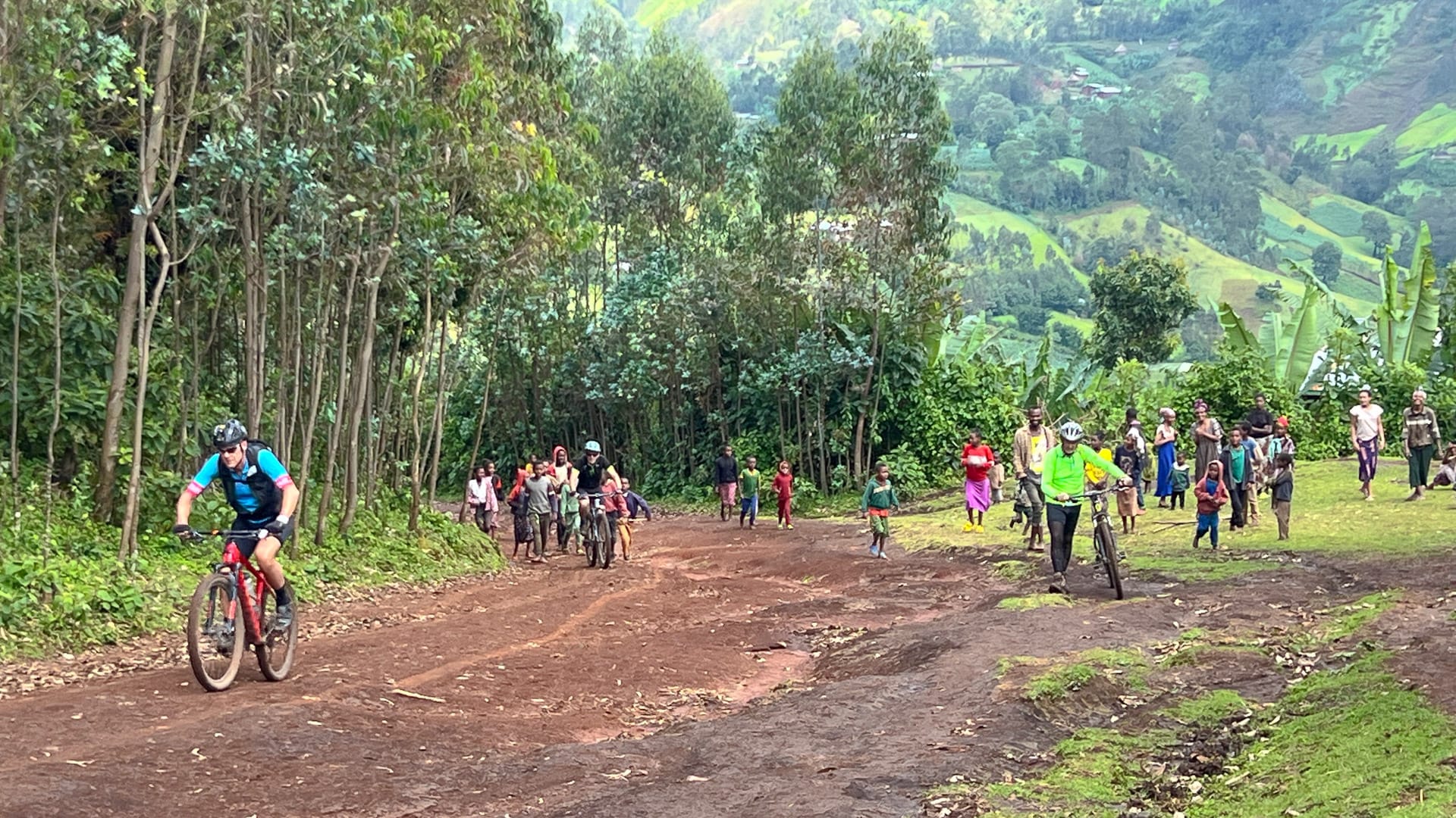 Mountain biker racing on a dirt road during a cycling event in rural Ethiopia