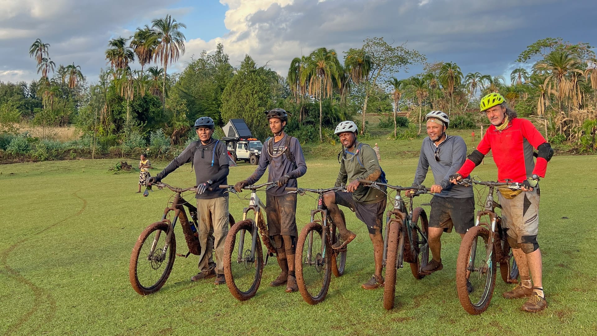Four cyclists taking a group photo in Gurage Highlands
